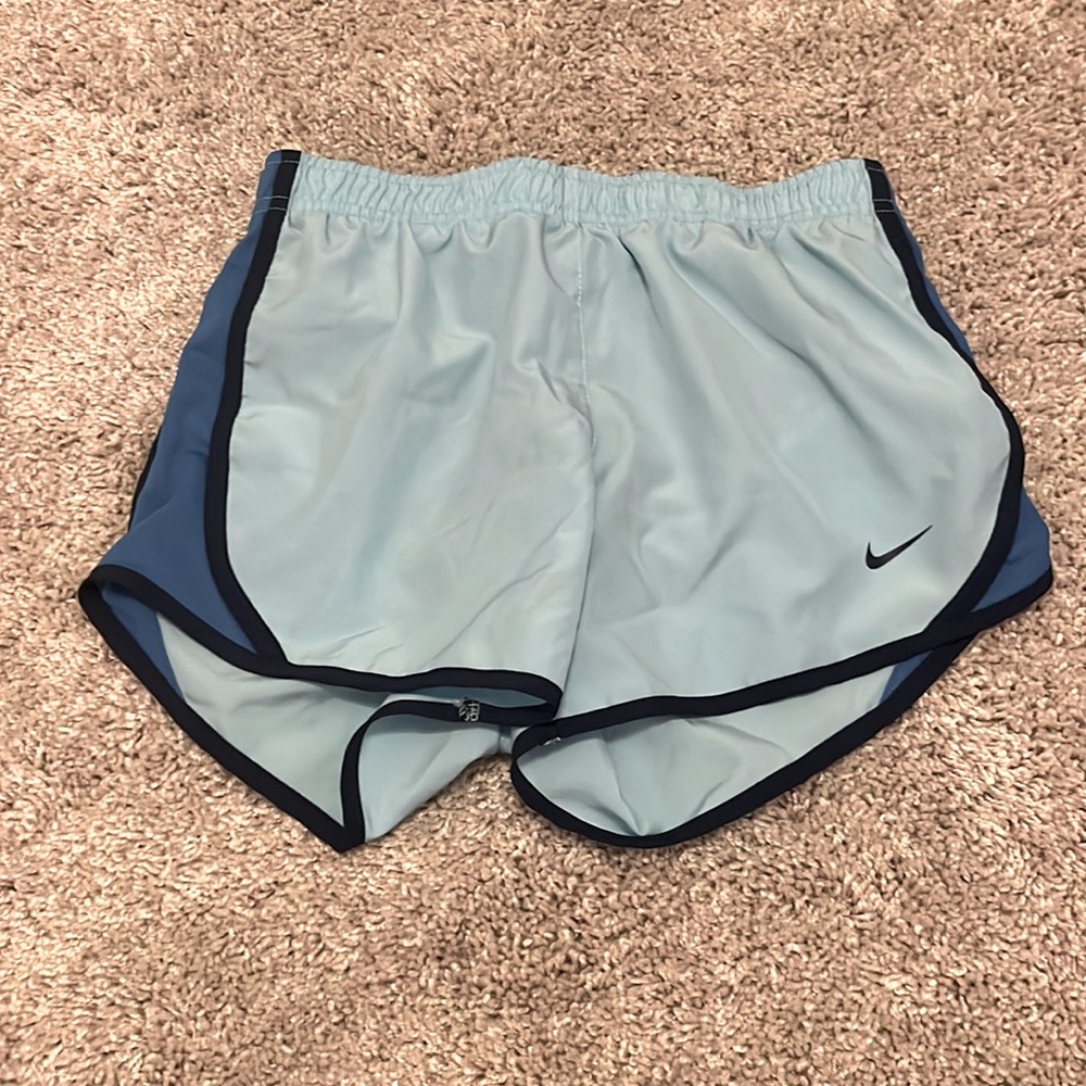 Light and dark blue nike athletic shorts.